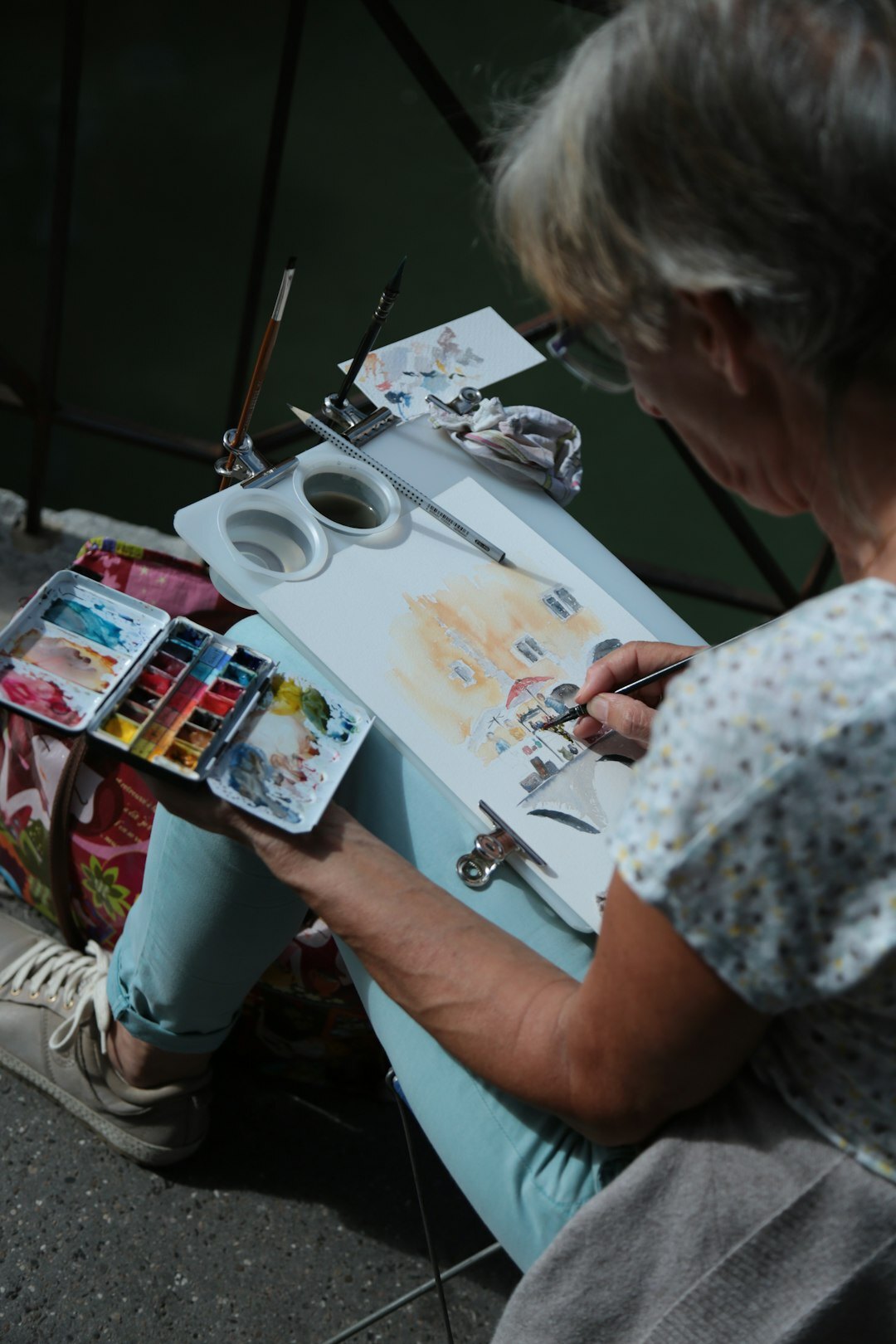 Senior citizens painting together during a creative art workshop