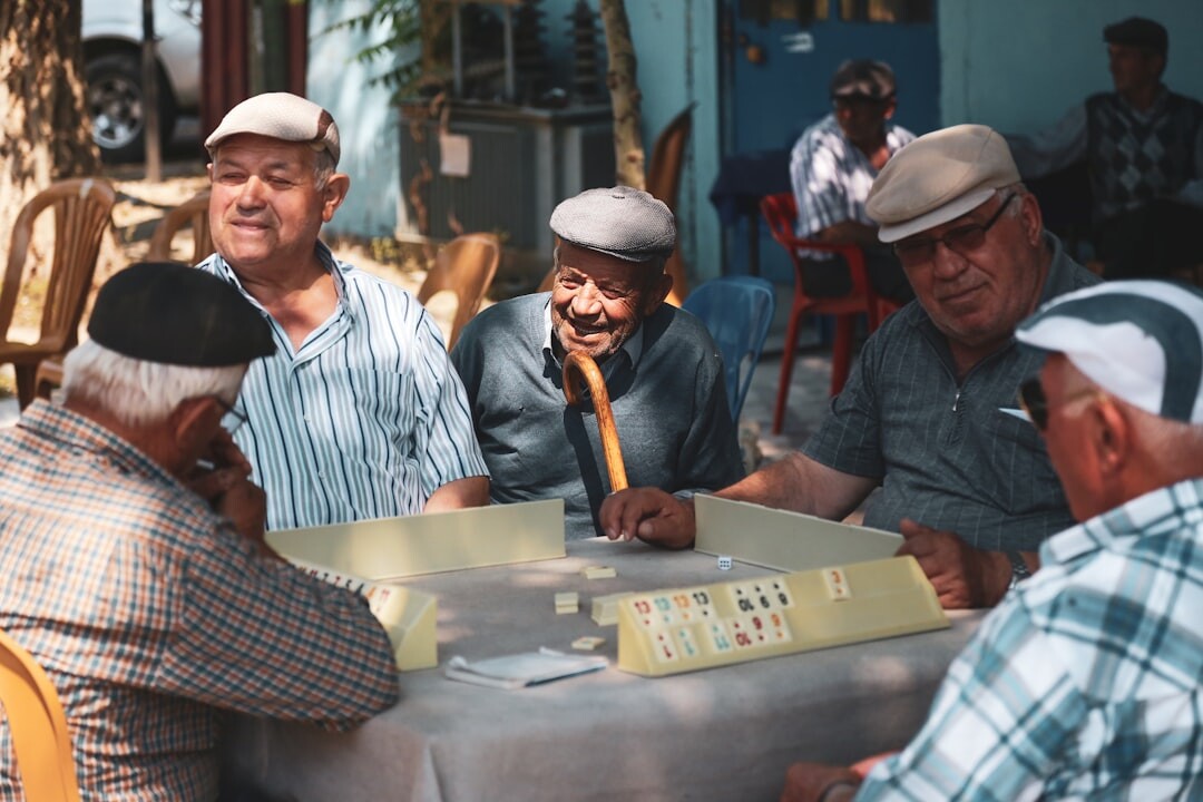 group of elderly friends laughing together